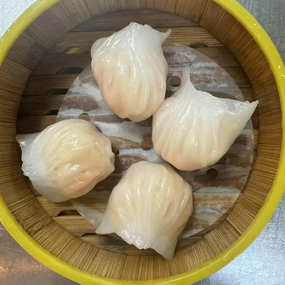 Four translucent shrimp dumplings at Easy Joy Hot Pot Dim Sum Buffet，a Chinese Restaurant in New York
